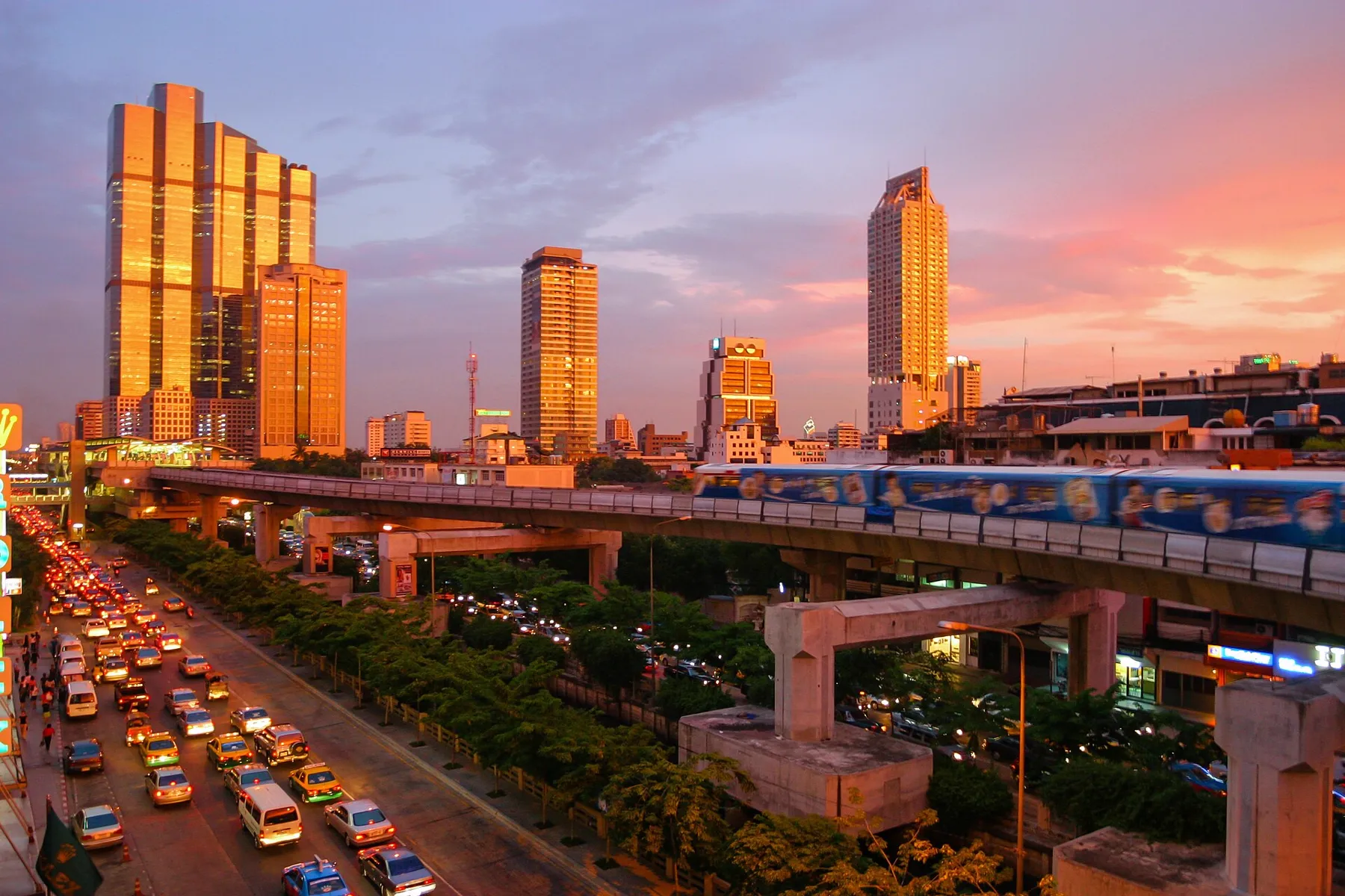 The Bangkok skyline and the BTS skytrain at sunset